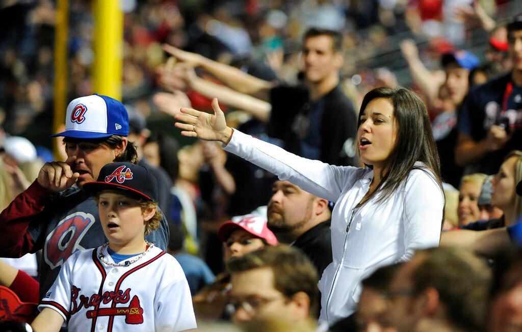 Atlanta Braves fans do the tomahawk chop