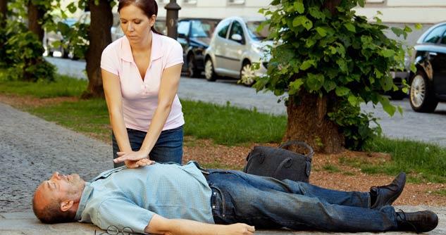 woman giving man cpr