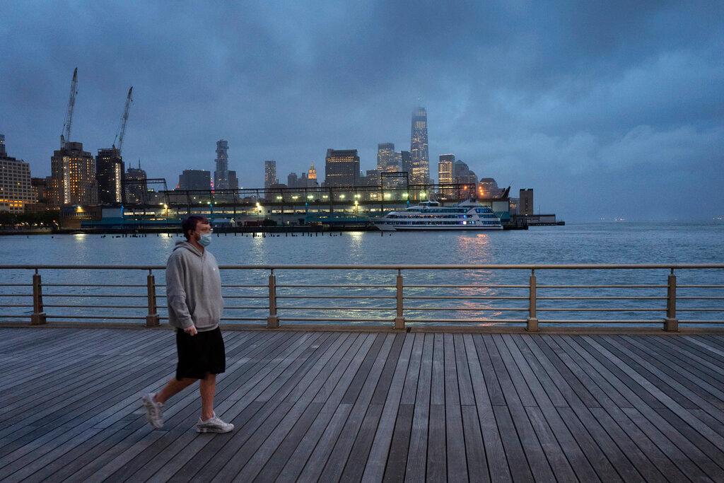 Young man walking on pier in NYC 