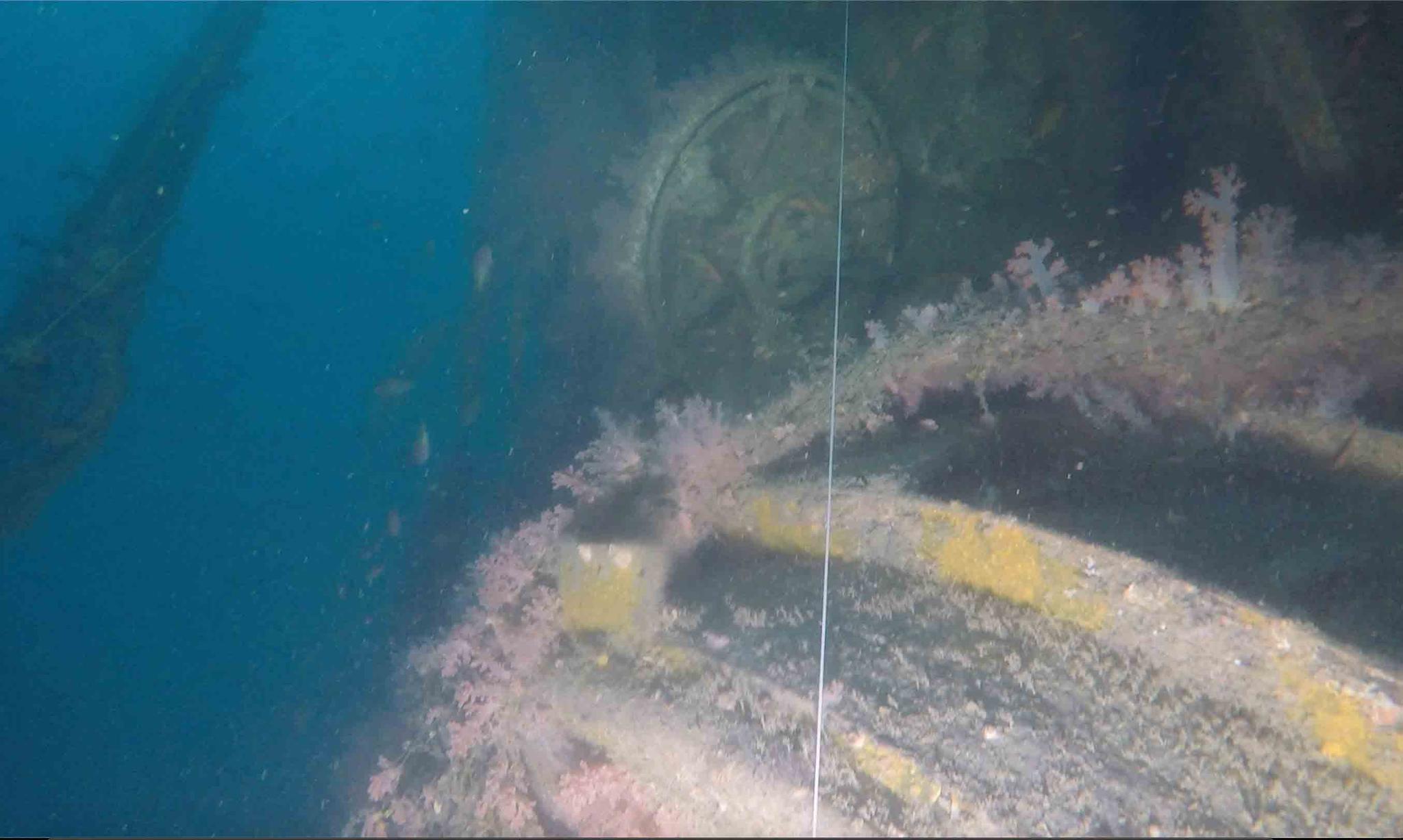 In this image taken from video, the top hatch of a conning tower can be seen from a submarine wreck somewhere in the Strait of Malacca on March 4, 2020.