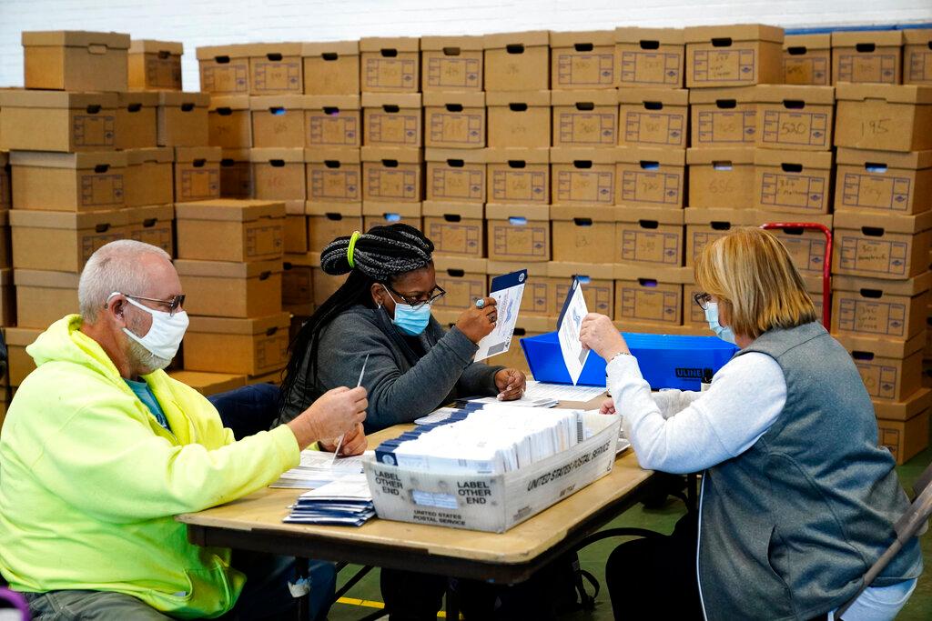 Election workers process ballots 