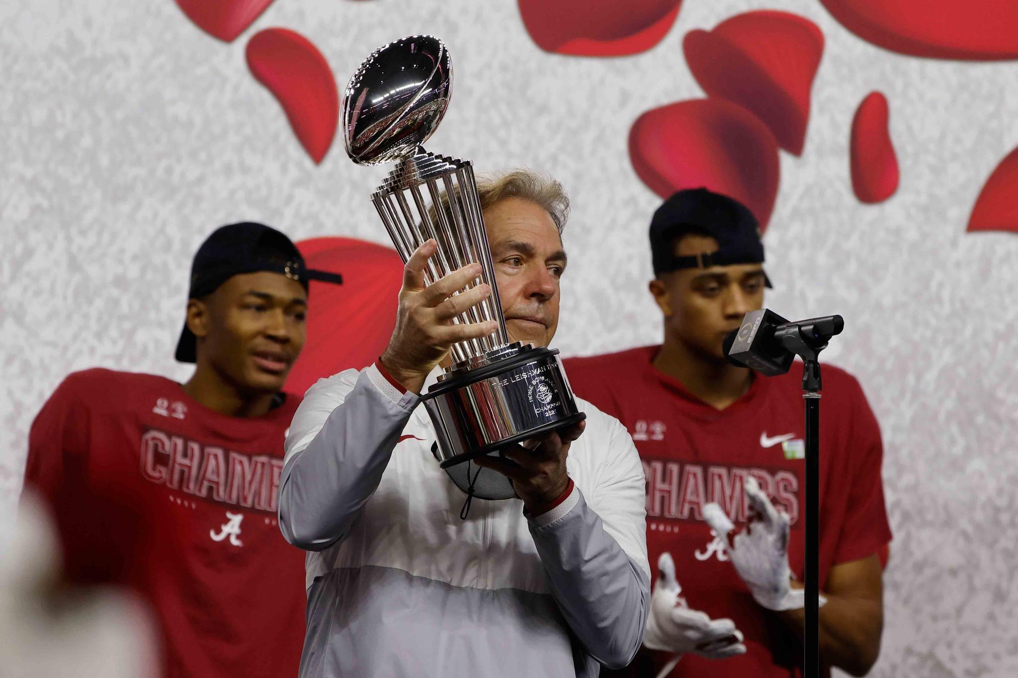 Alabama head coach Nick Saban holds up the trophy after their 31-14 win over Notre Dame in the Rose Bowl NCAA college football game in Arlington, Texas, Friday, Jan. 1, 2021.