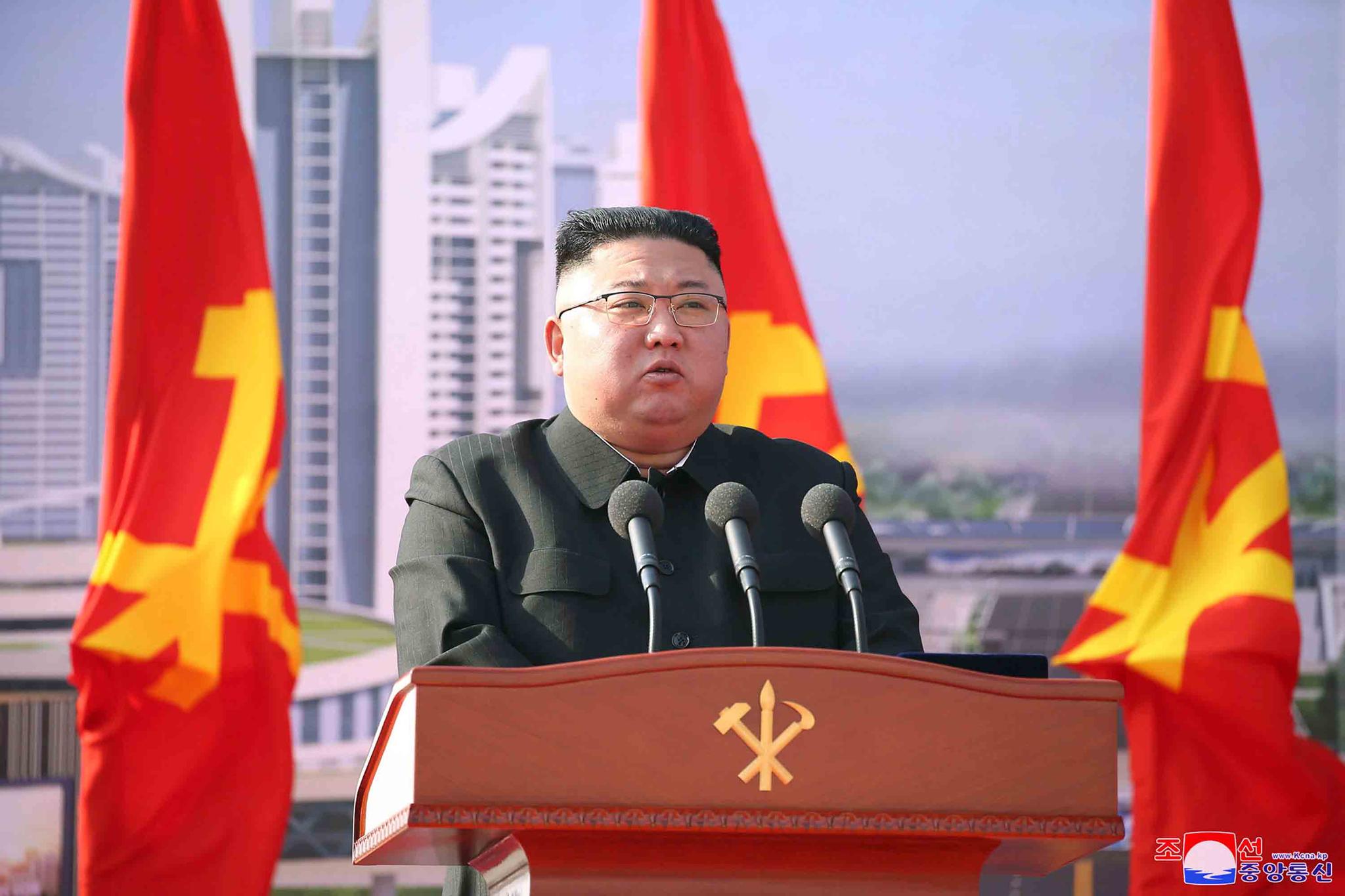 In this photo provided by the North Korean government, North Korean leader Kim Jong Un speaks during a ceremony to break ground for building 10,000 homes, in Pyongyang, North Korea, Tuesday, March 23, 2021.