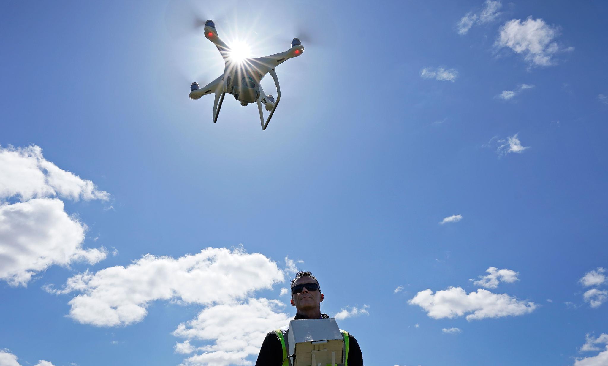 man flying a drone