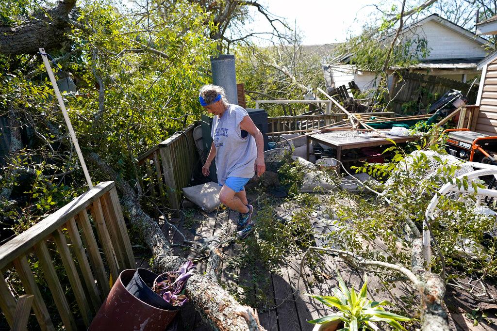 Woman sorts through damage to home in Lake Charles, LA