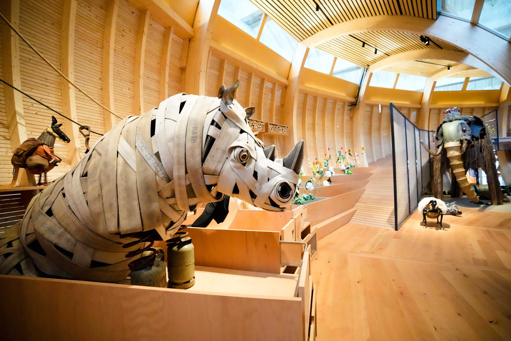 Animals made out of recycled materials are on display at an interactive exhibit