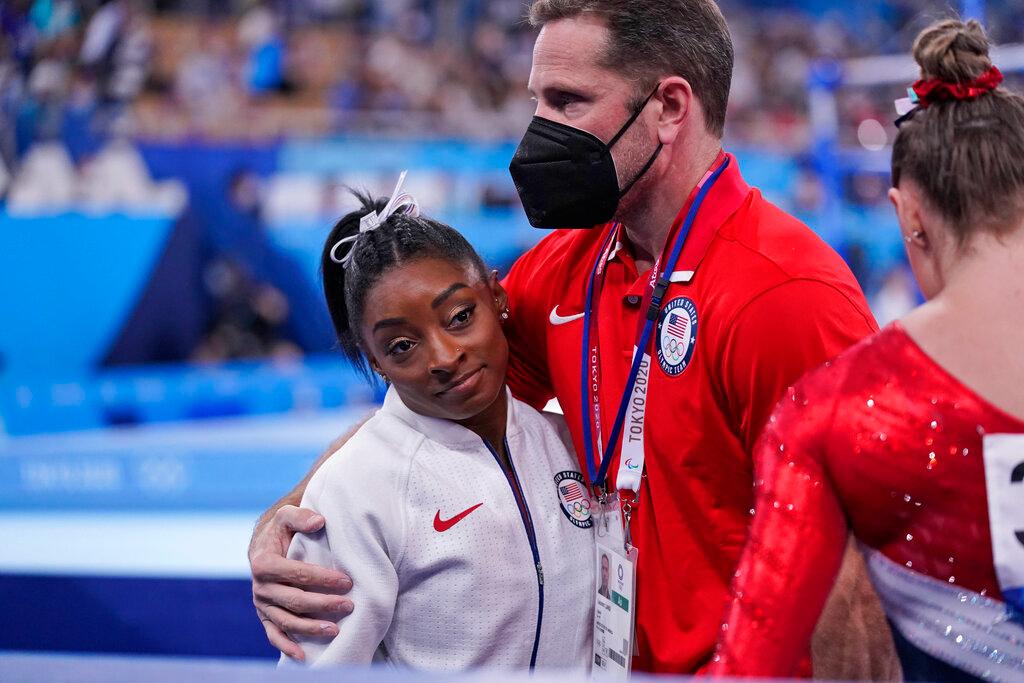 Simone Biles with her coach 