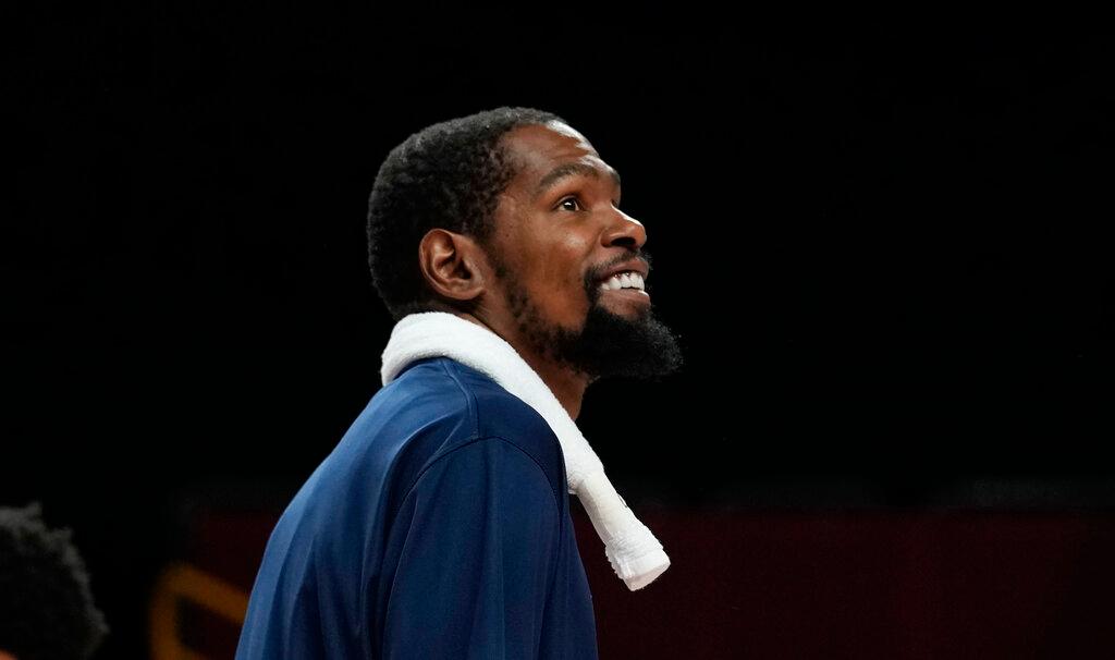 United States' Kevin Durant smiles after their win in the men's basketball preliminary round game against Iran at the 2020 Summer Olympics, Wednesday, July 28, 2021, in Saitama, Japan.