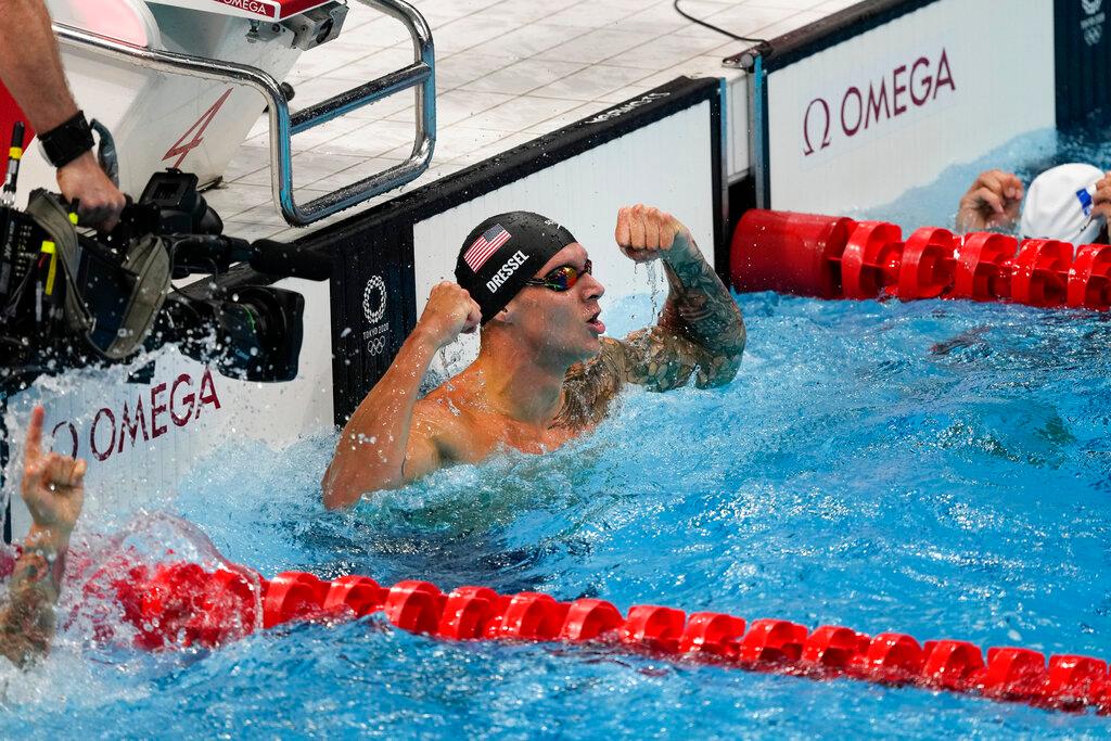 Caeleb Dressel, of the United States, celebrates after winning the gold medal in the men's 50-meter freestyle final 