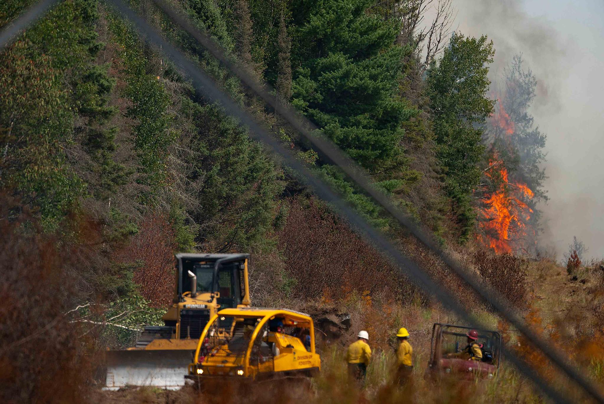 Smoke rises above the Superior National Forest as the Greenwood Fire burns through towards Highway 2 on Monday, Aug. 16, 2021, in Duluth, Minn.