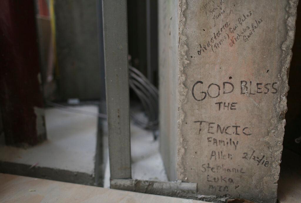 (July 22, 2021) Personal notes, prayers and names are written on the incomplete walls of St. Nicholas Greek Orthodox Church and National Shrine