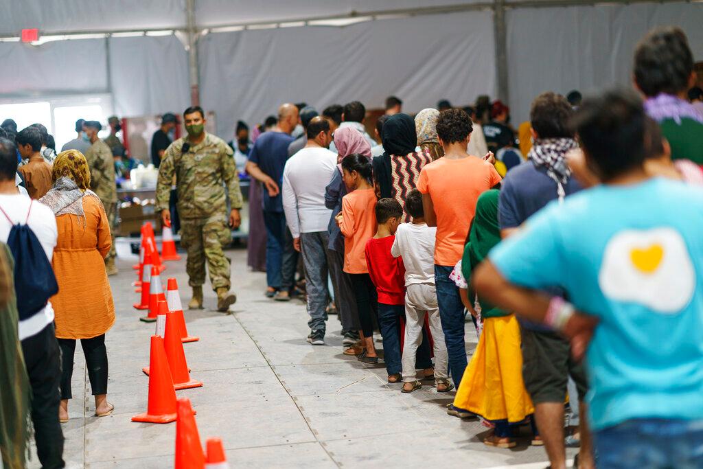 Afghan refugees line up for food in a dining hall at Fort Bliss' Doña Ana Village, in New Mexico