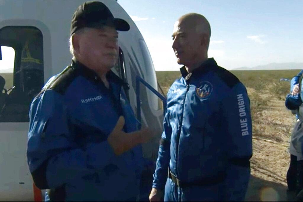 William Shatner talks with Jeff Bezos about his experience after exiting the Blue Origin capsule near Van Horn, Texas