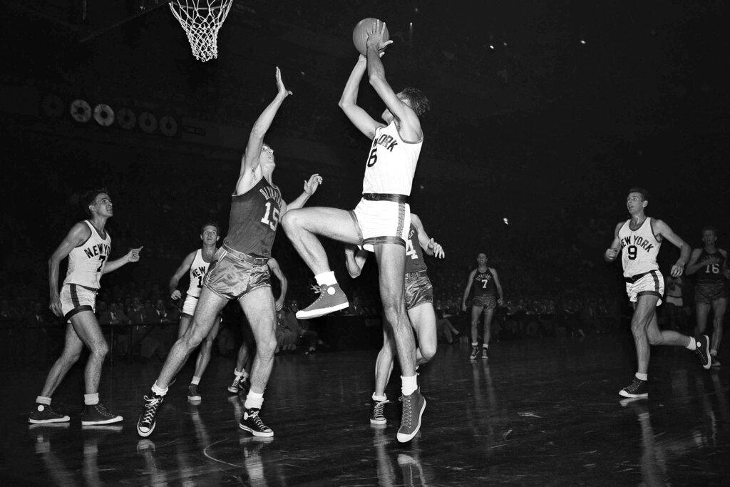 From 1949, Alex Groza bloks a shot attempt by center Connie Simons 