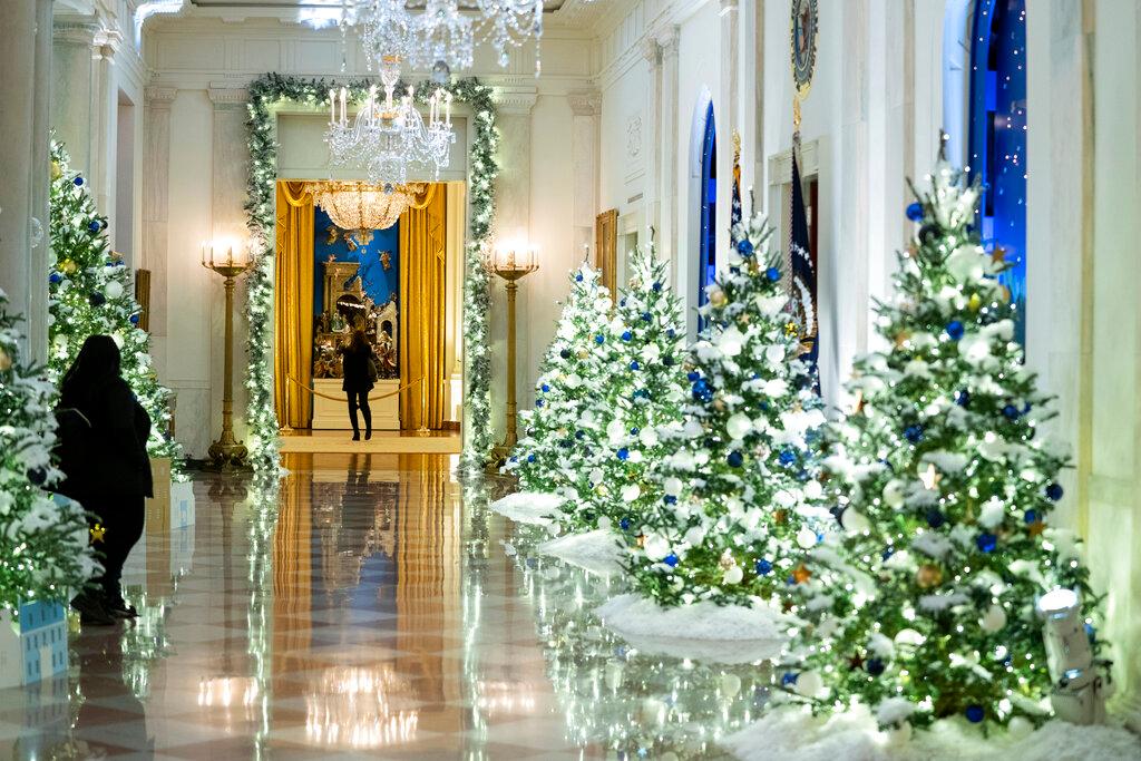 The Cross Hall of the White House is decorated for the holiday season during a press preview of the White House holiday decorations