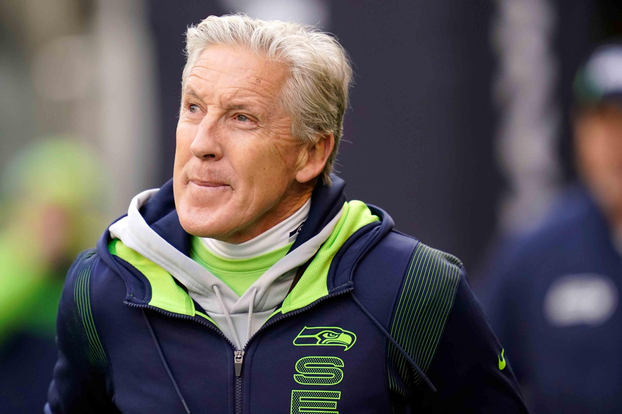 Seattle Seahawks head coach Pete Carroll walks on the field before an NFL football game against the San Francisco 49ers, on Dec. 5, 2021, in Seattle.