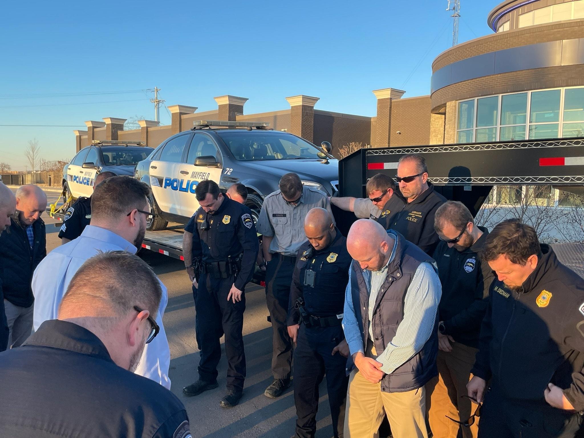 Lebanon, Tenn. Police pray over patrol cars they donated to tornado-wrecked Mayfield, Ky.