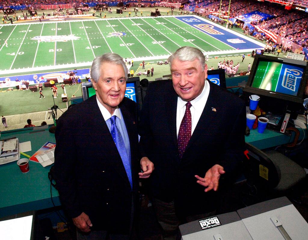 Broadcasters Pat Summerall and John Madden in broadcast booth at Super Bowl 36 in New Orleans 