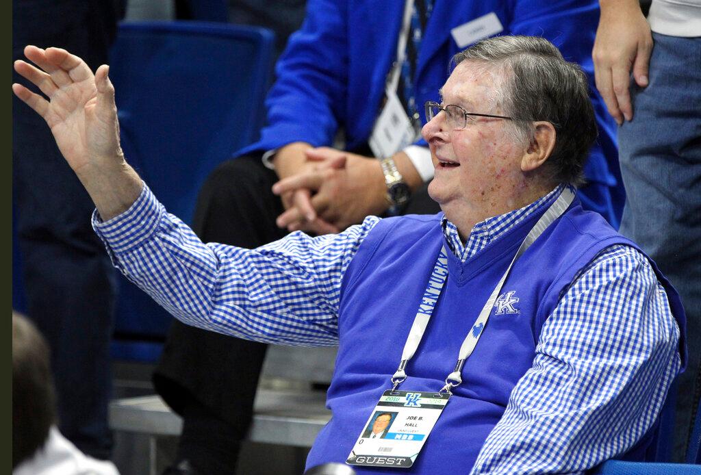 Former Kentucky coach Joe B. Hall waves to the crowd during the first half of the team's NCAA college basketball game against UAB in Lexington, Ky