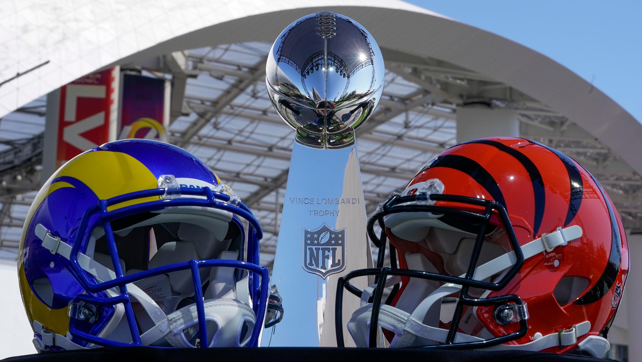 Super Bowl team helmets with Vince Lombardi Trophy