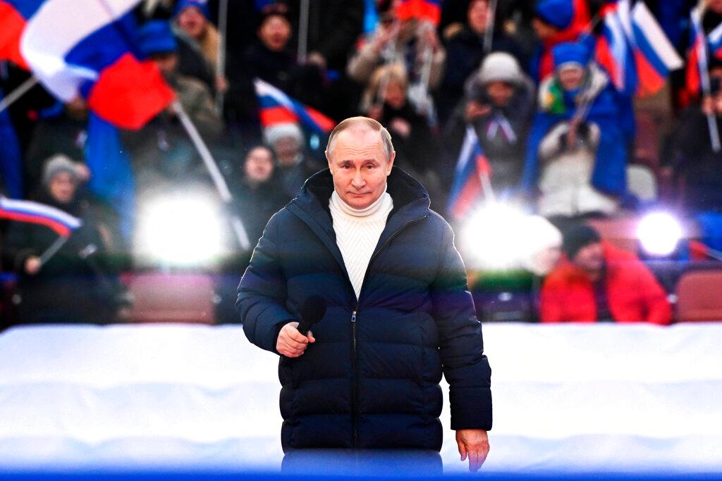 Russian President Vladimir Putin delivers his speech at a concert marking the eighth anniversary of the referendum on the state status of Crimea and Sevastopol and its reunification with Russia