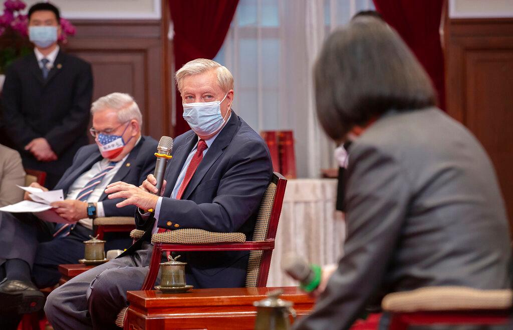 Sen. Lindsey Graham, R-S.C., left, speaks as Taiwan's President Tsai Ing-wen, right, listens during a meeting at the Presidential Office in Taipei, Taiwan 