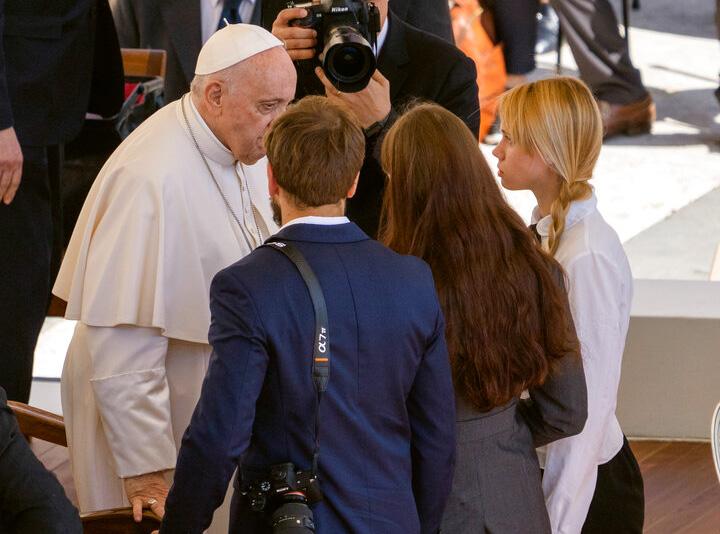 Kateryna Prokopenko, right, wife of Azov Battalion Commander Denys Prokopenko, and Yuliia Fedosiuk, second from right, from Ukraine, talk with Pope Francis, at the end of the weekly general audience, in St. Peter's Square