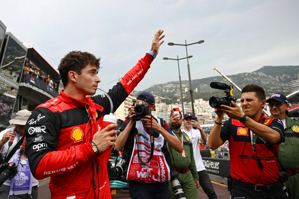 Charles Leclerc waves to the cameras