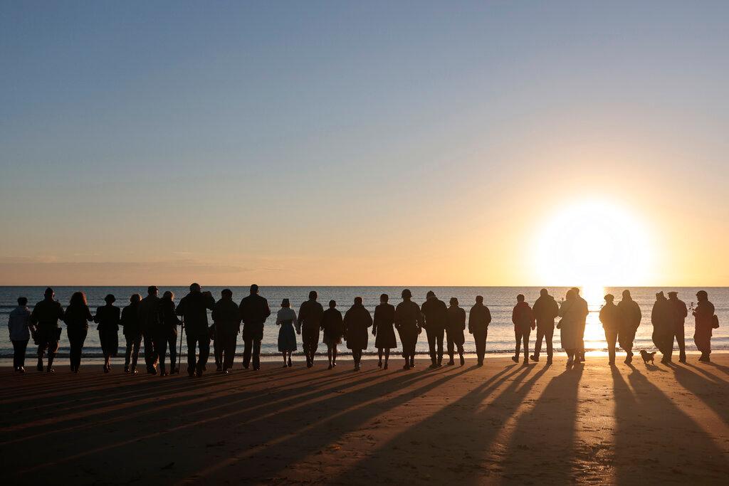 World War II reenactors gather on Omaha Beach in Saint-Laurent-sur-Mer, Normandy, France