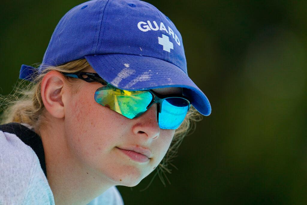 Lifeguard Elizabeth Conley keeps an eye on the swimmers at the Douglass Park pool in Indianapolis