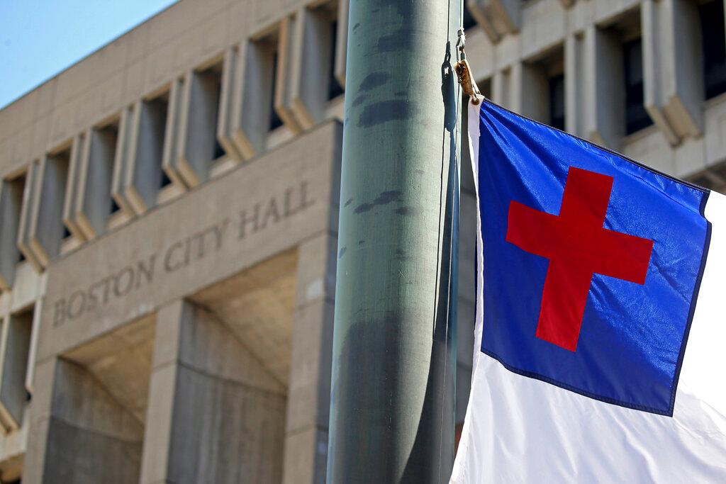 The Christian Flag is raised at City Hall Plaza Wednesday, Aug. 3, 2022 in Boston.