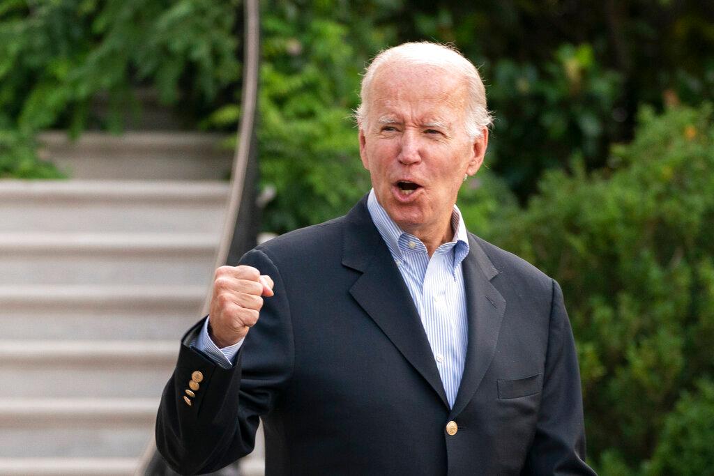 President Joe Biden responds to reporters questions as he walks to board Marine One on the South Lawn of the White House in Washington, on his way to his Rehoboth Beach, Del., home after his most recent COVID-19 isolation, Sunday, Aug. 7, 2022. 