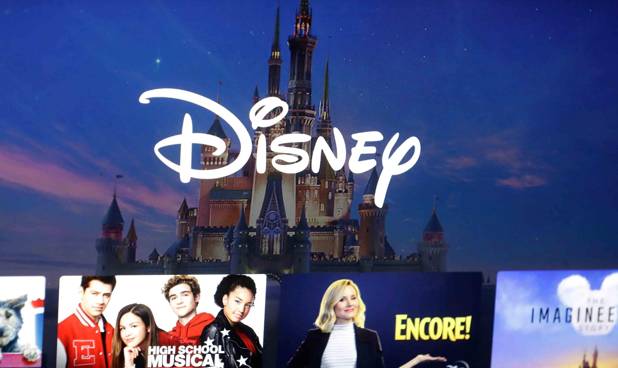  In this Nov. 13, 2019, photo, a Disney logo forms part of a menu for the Disney Plus movie and entertainment streaming service on a computer screen in Walpole, Mass. 