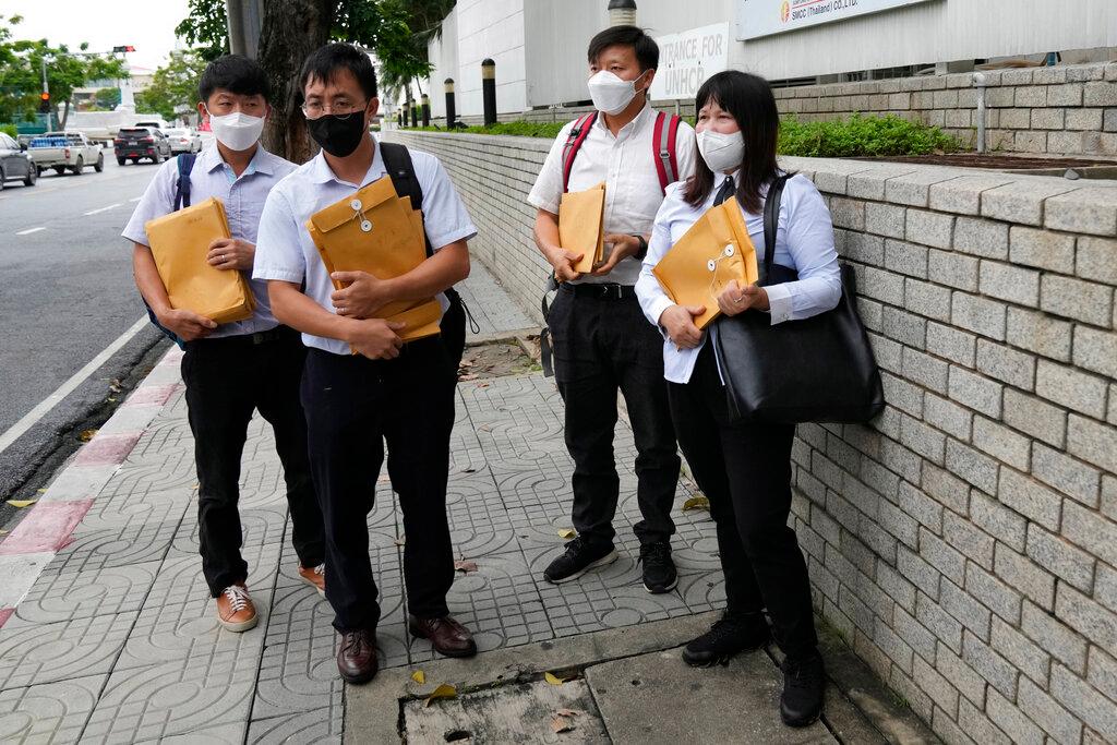 Members of the Shenzhen Holy Reformed Church in China prepare to submit their applications for asylum at the United Nations High Commissioner for Refugees UNHCR office in Bangkok, Thailand