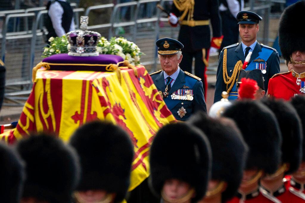 Britain's King Charles III and Prince William follow the coffin of Queen Elizabeth II