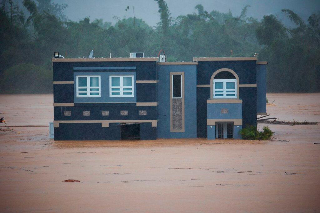 Image of home in the middle of flood.