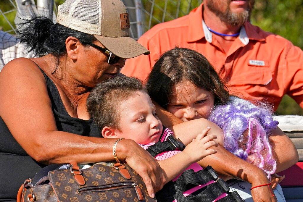 https://newsroom.ap.org/detail/HurricaneIanclosessomeFloridaschoolsindefinitely/65729caca143510df40ab8e1ff3d4ba4/text?hpSectionId=48299c2cd11648c7aef53ad923aed05e&st=hpsection&mediaType=text&sortBy=arrivaldatetime:desc&dateRange=Anytime&totalCount=323&currentItemNo=0#:~:text=Yolanda%20Rios%2C%20left%2C%20holds%20her%20grandchildren%20Ava%2C%207%2C%20and%20Giovanni%2C%205%2C%20as%20as%20they%20are%20evacuated%20by%20airboat%20through%20floodwaters%20along%20the%20Peace%20River