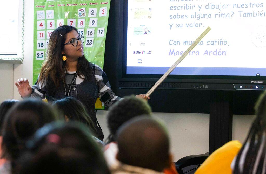 Fatima Nunez Ardon, a teacher in training, teaches Spanish to second graders at Madrona Elementary School in SeaTac, a suburb in Seattle, Wash.