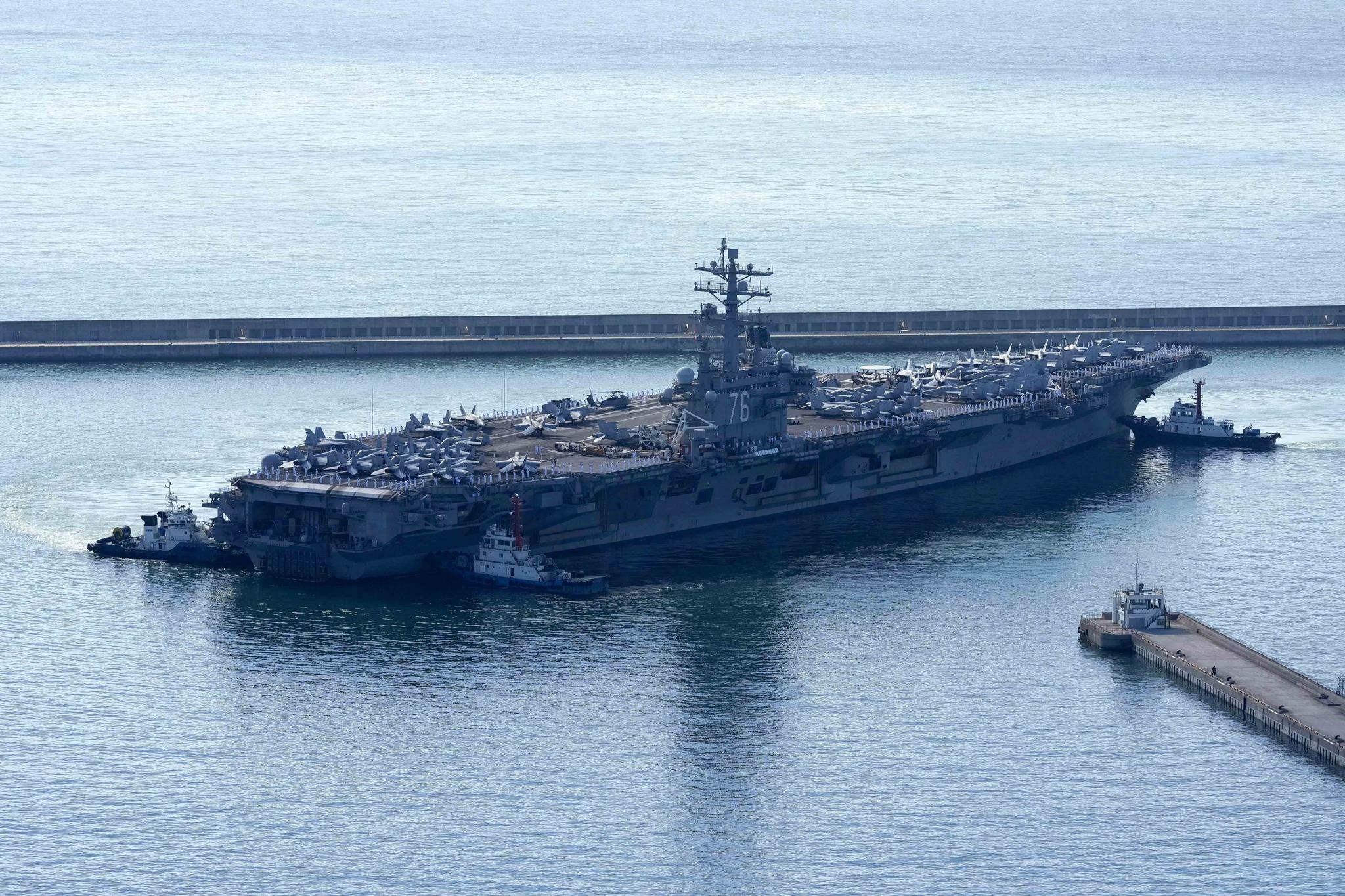 The U.S. carrier USS Ronald Reagan is escorted as it arrives in Busan, South Korea on Sept. 23, 2022. North Korea warned Saturday, Oct. 8