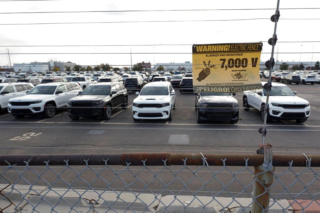 New vehicles are shown parked in storage lots near the the Stellantis Detroit Assembly Complex in Detroit, Wednesday, Oct. 5, 2022. Over the past few years, thieves have driven new vehicles from automaker storage lots and dealerships across the Detroit area. In 2018, eight vehicles were driven from what then was Fiat Chrysler's Jefferson North plant.