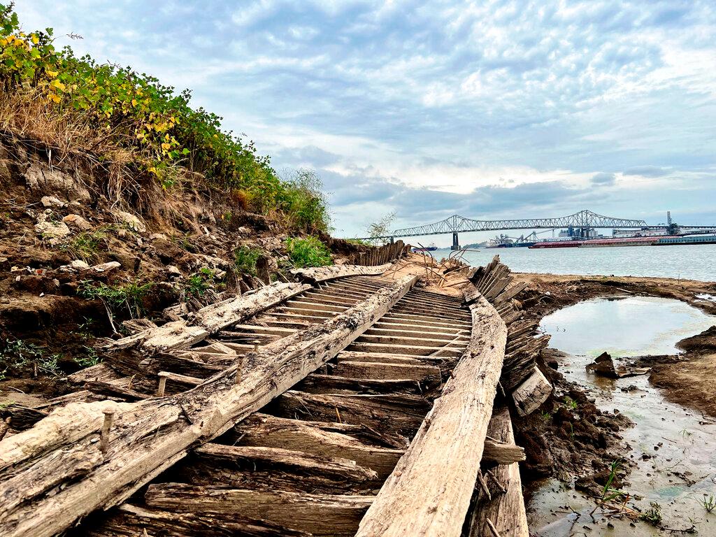 The remains of a ship lay on the banks of the Mississippi River in Baton Rouge, La., on Monday, Oct. 17, 2022, after recently being revealed due to the low water level.