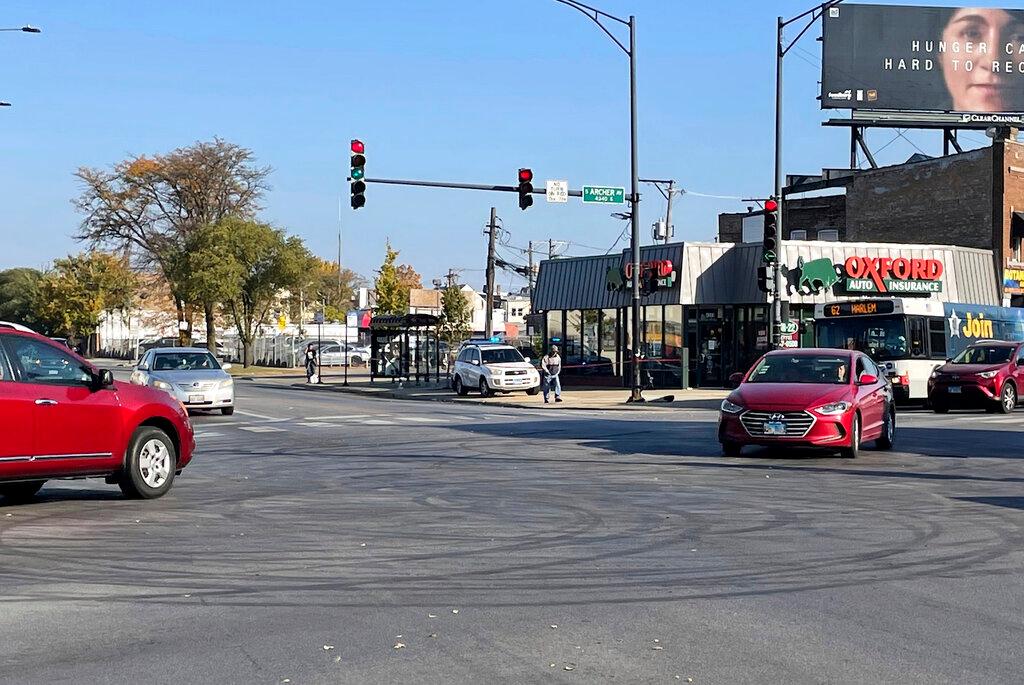 Tire marks from drifting can be seen in the intersection of Archer and Kedzie avenues, where a shooting occurred early Sunday, Oct 23, 2022.