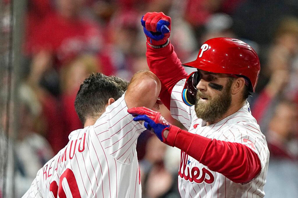 Philadelphia Phillies' Bryce Harper celebrates his two-run home run during the first inning in Game 3 of baseball's World Series between the Houston Astros and the Philadelphia Phillies