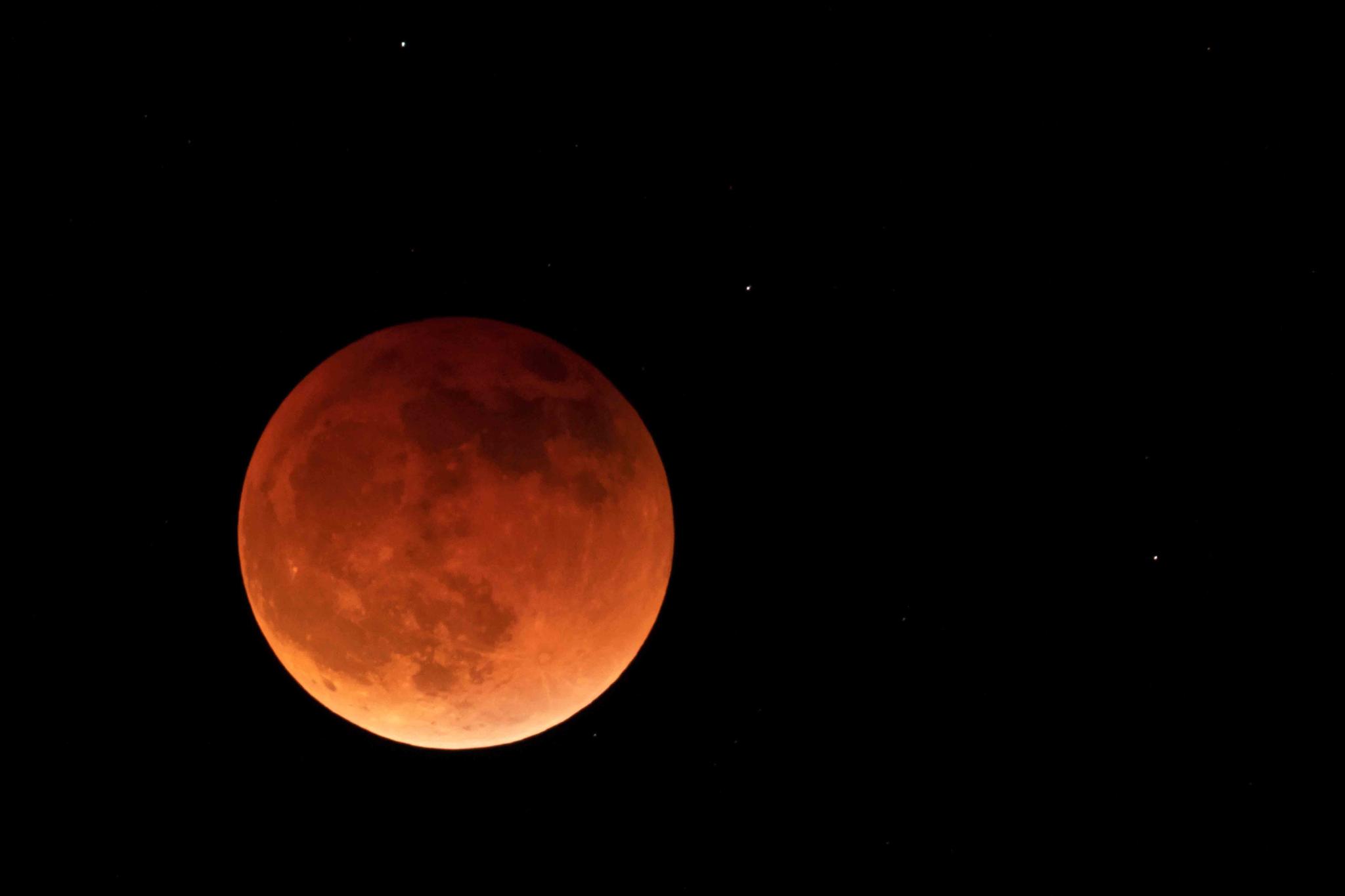 Known as a blood moon, it will appear a reddish-orange from the light of Earth’s sunsets and sunrises.