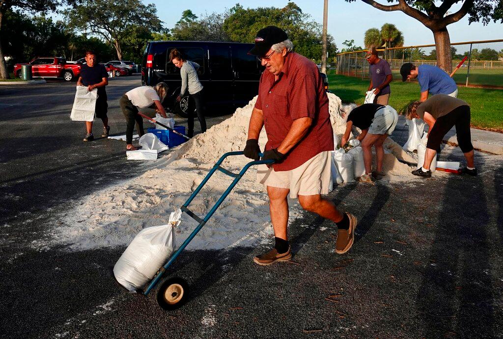 Sandbags are distributed at Mills Pond Park in Fort Lauderdale