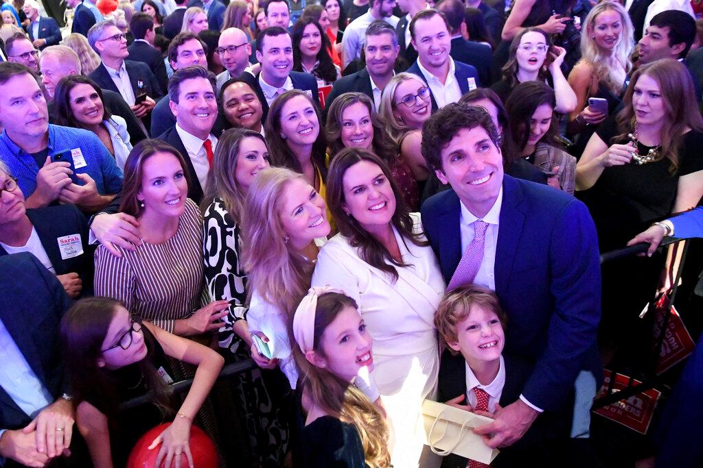 Arkansas Gov.-elect Sarah Huckabee Sanders, center, poses for a photo with family and supporters during her election night party 