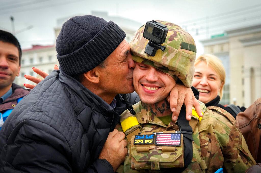 A Kherson resident kisses a Ukrainian soldier - Russian retreat from Kherson marked a triumphant milestone in Ukraine's pushback against Moscow's invasion