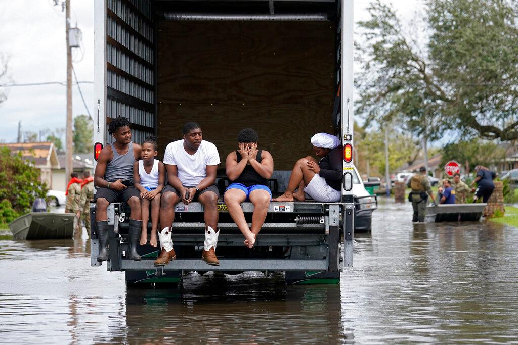 People are evacuated from floodwaters in the aftermath of Hurricane Ida in LaPlace, La., on Aug. 30, 2021