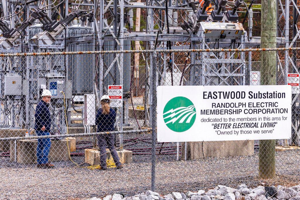 Workers with Randolph Electric Membership Corporation work to repair the Eastwood Substation in West End, N.C., Dec. 6, 2022. Federal regulators on Thursday, Dec. 15, ordered a review of security standards at the nation's far-flung electricity transmission network, following shootings at two electric substations in North Carolina that damaged equipment and caused more than 45,000 customers to lose power.