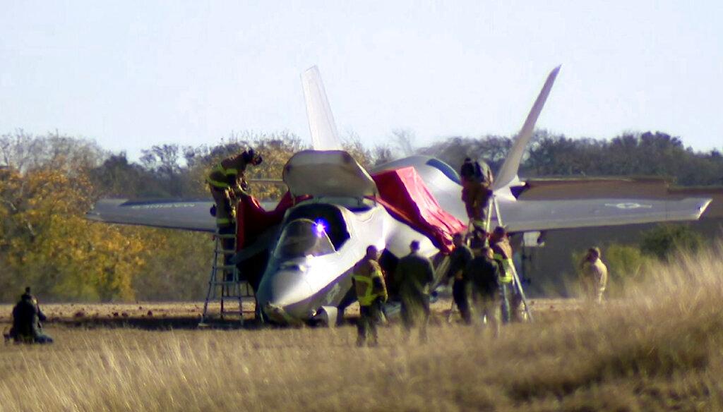 Emergency personnel at scene after fighter jet crash lands at Naval Air Station Joint Reserve Base in Fort Worth, Texas